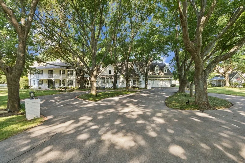 Oak-lined drive leading to a Parker home