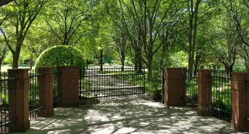 Gated entry framed by trees in Parker